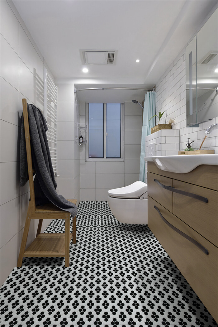 highlight your bathroom with black and white snowflake patterned floor tiles.jpg