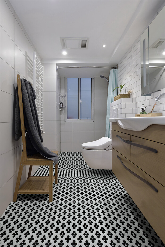 highlight your bathroom with black and white snowflake patterned floor tiles.jpg