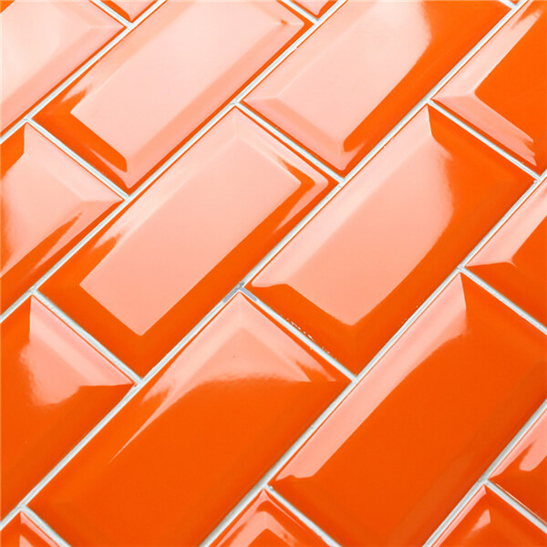 reflective surface orange subway tile.jpg