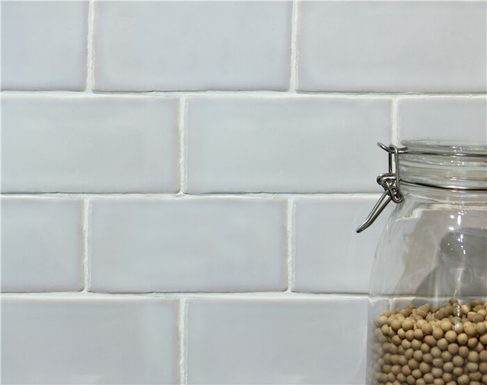 wavy edge grey and white subway tile.jpg