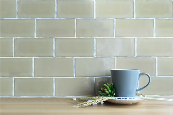 wavy tan colored subway tile.jpg