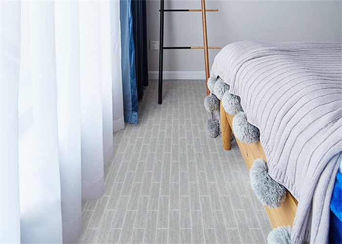 bedroom using oak wood effect floor tile for cozy atmosphere.jpg