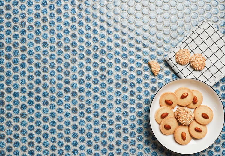 Add charm to your kitchen backsplash with ceramic penny round mosaic tiles.jpg