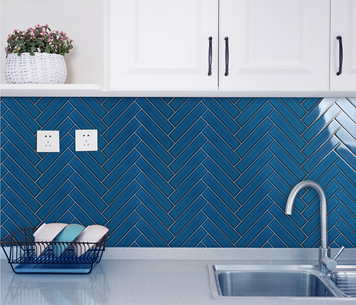 royal style kitchen decorated with dark blue herringbone tile.jpg