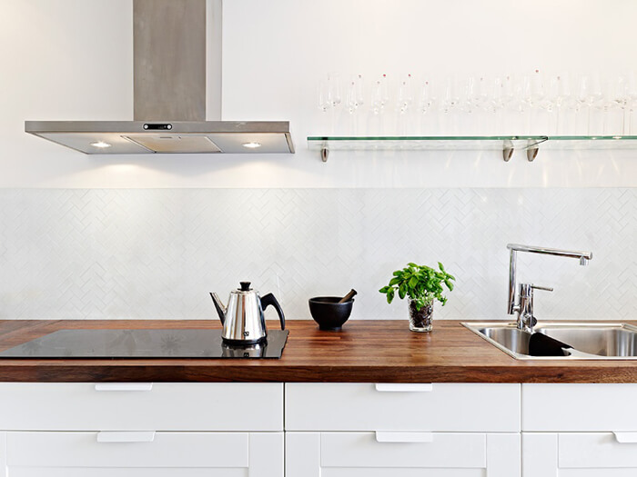 herringbone matte white small rectangular mosaic tile kitchen backsplash.jpg