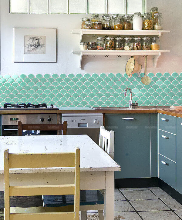 mint hue kitchen backsplash with fan shaped tile