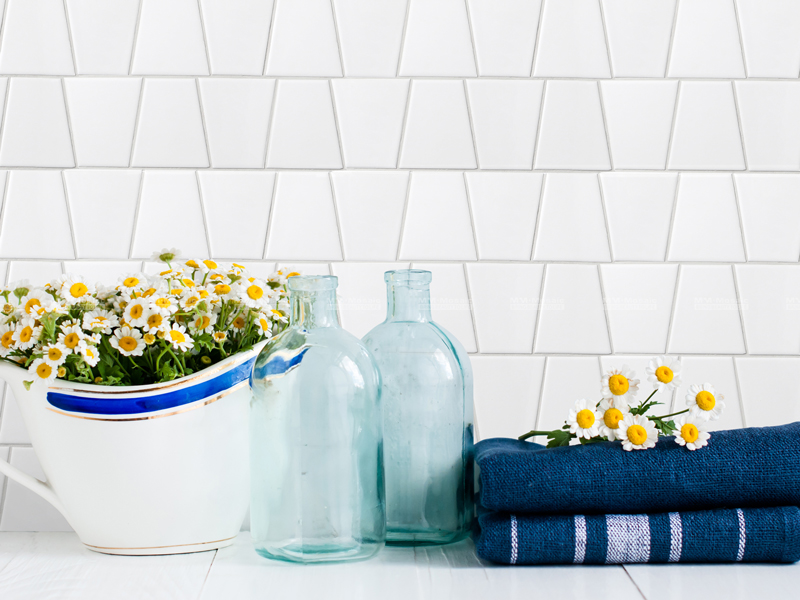 white trapezoid tiles as feature wall