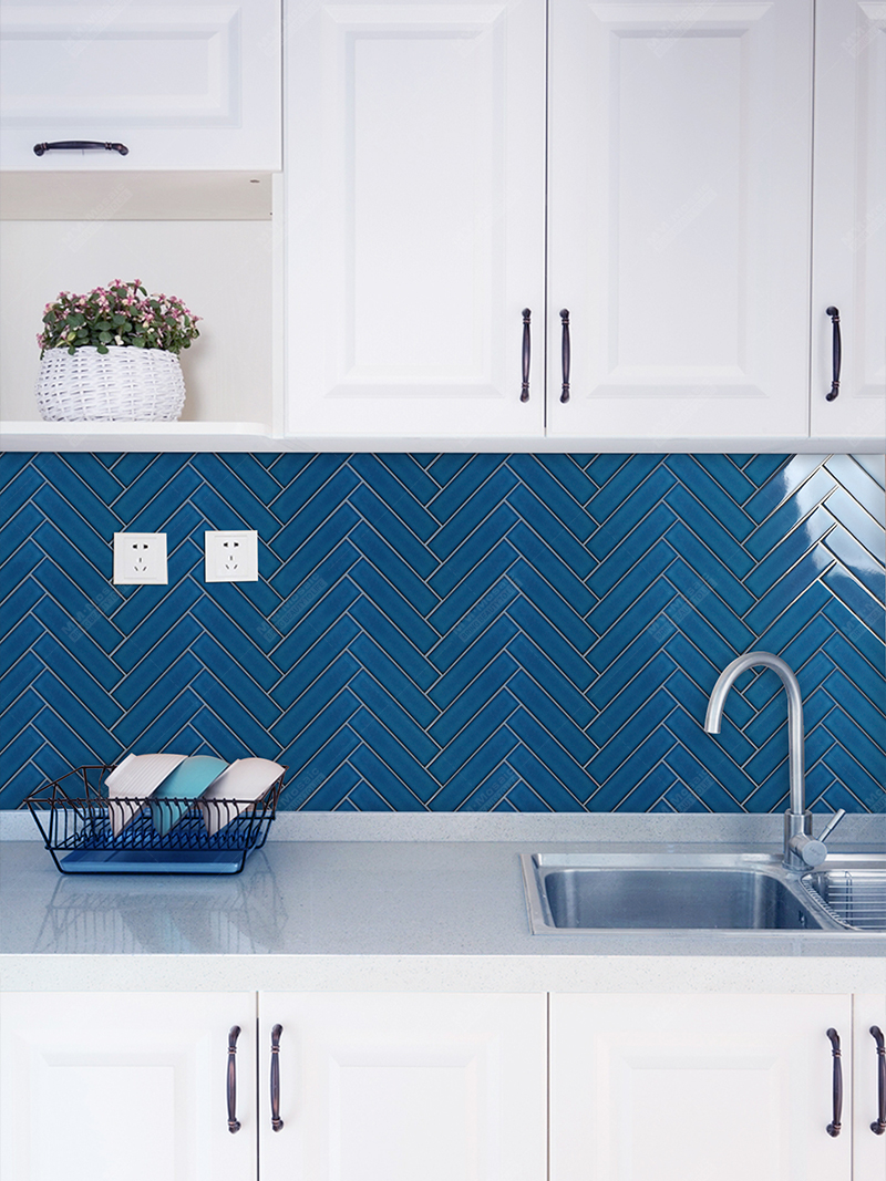 blue herringbone tile backsplash